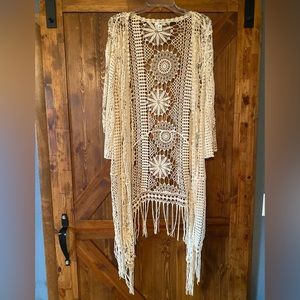Large crocheted boutique cardigan, ivory colored , very nice.